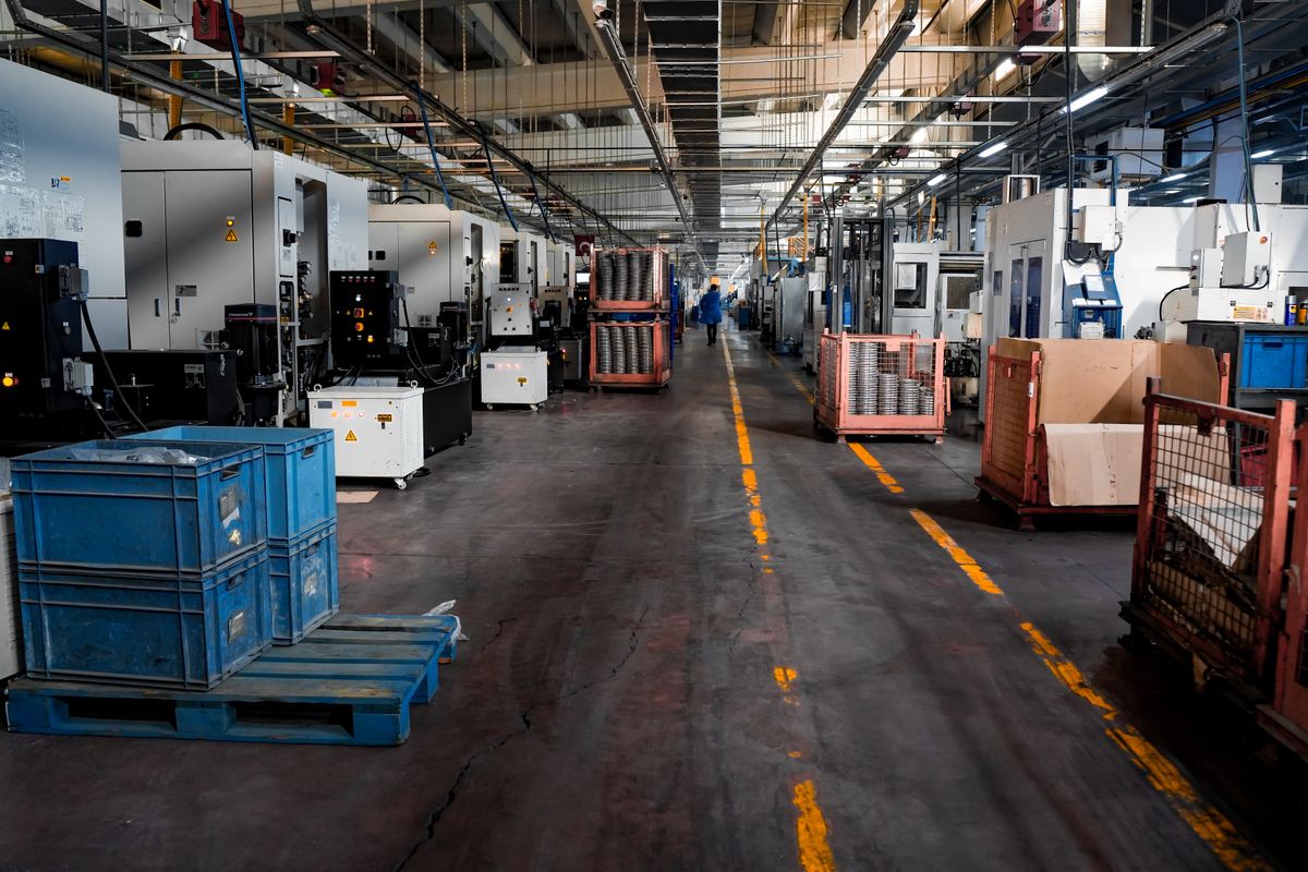 Large industrial floor with machinery and crates